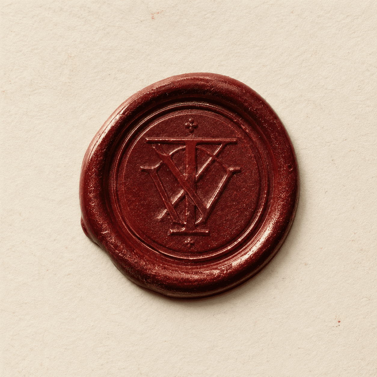 The Intervues wax seal, pressed in oxblood